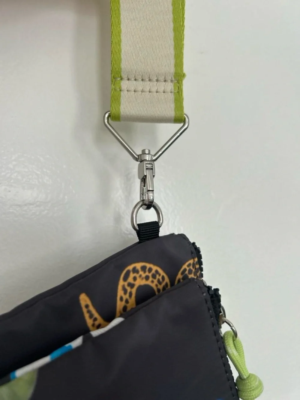 Printed Black Nylon Wristlet Pouch with Lime Accent from Parfois